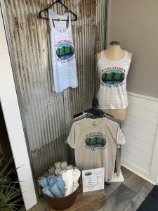 display of Wisconsin River Trail Organization t-shirts and tank tops for sale at Willow and Ivy